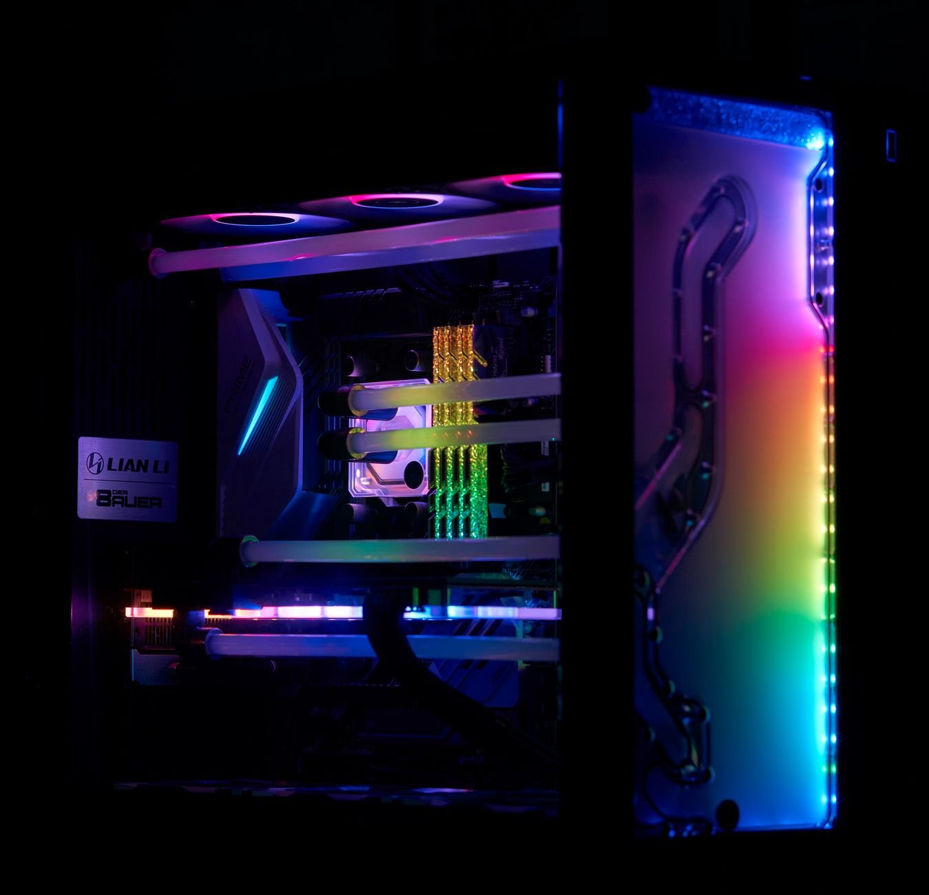 A high-performance gaming PC with vibrant RGB lighting and visible internal components.